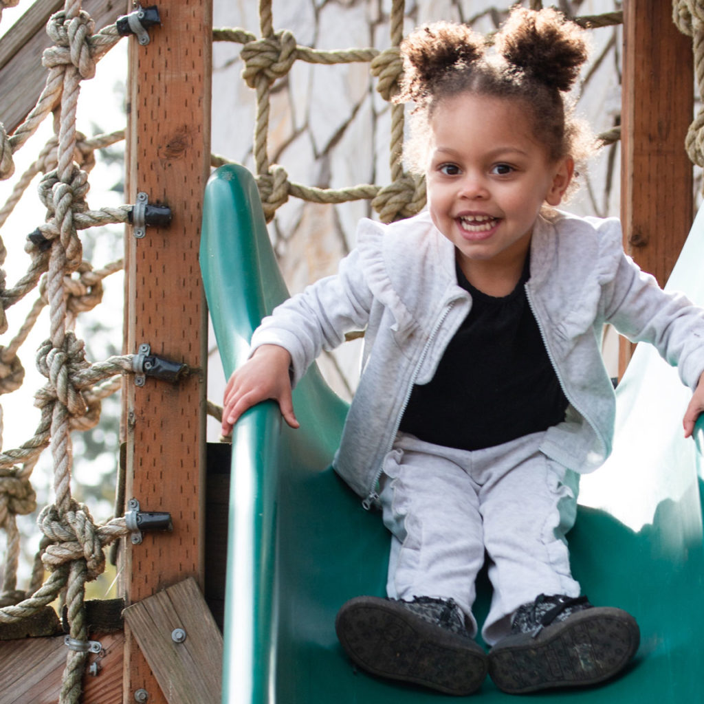 Playing on a slide at Swapnplay